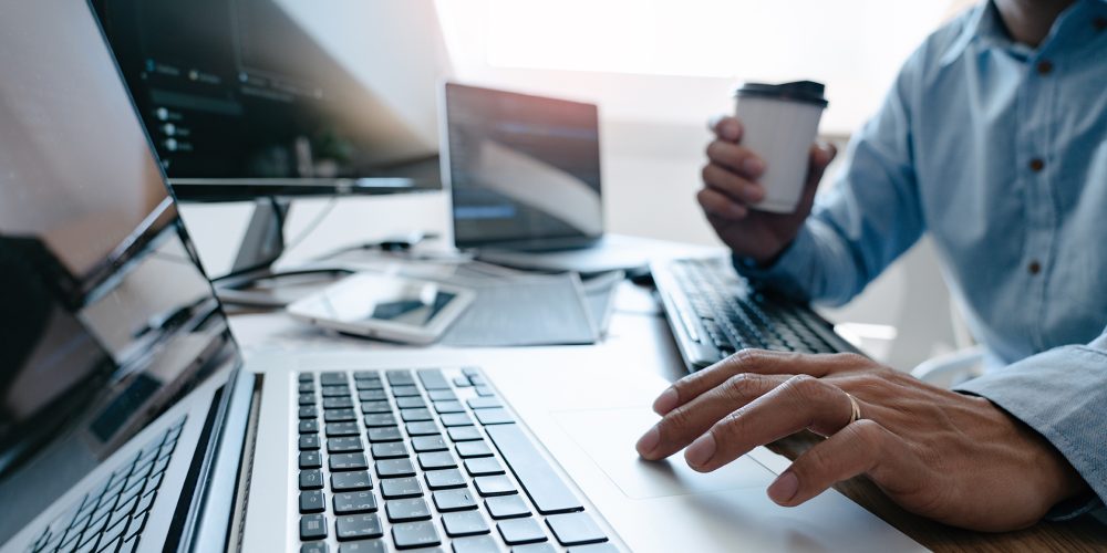 Programmer Typing Code on desktop computer, Developing programming and coding technologies concept